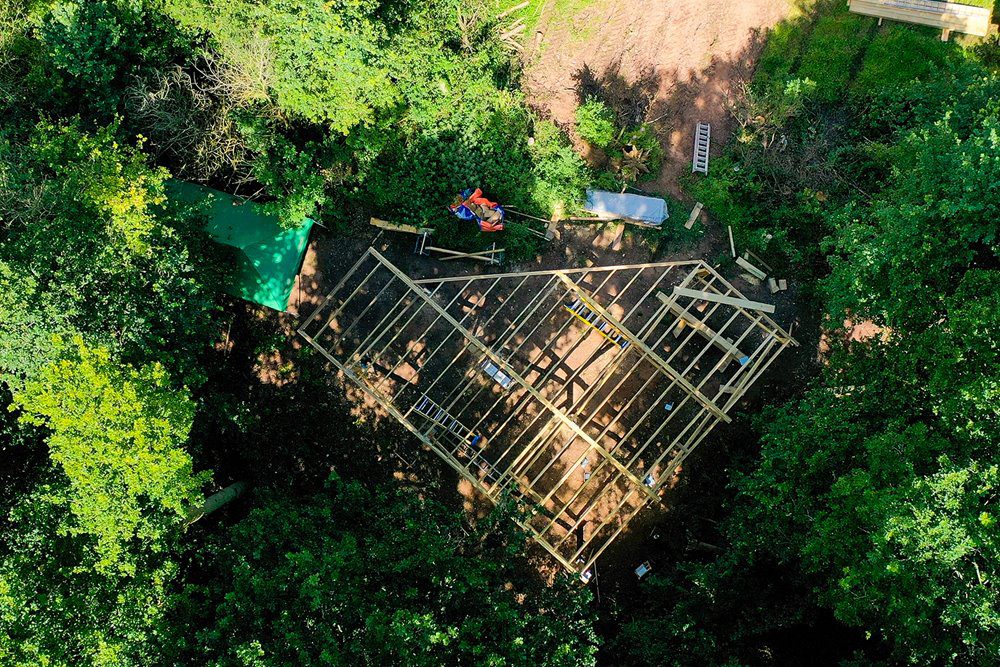 Woodland treehouses under construction at Elmore Estate in Stroud District